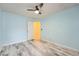 Bedroom featuring a ceiling fan, wood-look floors, and a closet at 162 Townview Dr, Woodstock, GA 30189