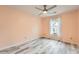 Comfortable bedroom with a large window and wood flooring at 162 Townview Dr, Woodstock, GA 30189