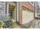 Inviting entrance featuring a brick facade and a convenient two-car garage at 162 Townview Dr, Woodstock, GA 30189