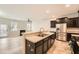 Spacious kitchen featuring a large island, stainless appliances, and open floor plan at 162 Townview Dr, Woodstock, GA 30189