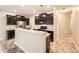 Modern kitchen with stainless steel appliances and a breakfast bar at 162 Townview Dr, Woodstock, GA 30189