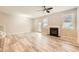 Bright living room features wood-look floors, fireplace, and lots of open space at 162 Townview Dr, Woodstock, GA 30189