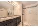 Modern bathroom with double sinks and glass enclosed shower at 162 Townview Dr, Woodstock, GA 30189