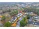 Aerial view featuring the property, showcasing landscaping, parking, and surrounding greenery at 23 Chelsea Ct, Avondale Estates, GA 30002