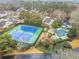 Aerial shot featuring tennis court, swimming pool, and well-maintained landscaping at 23 Chelsea Ct, Avondale Estates, GA 30002