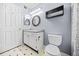Cozy bathroom with updated vanity, mirror, lighting, and black-and-white tile flooring at 23 Chelsea Ct, Avondale Estates, GA 30002