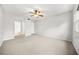 Bright bedroom with a ceiling fan, carpet, and closet at 23 Chelsea Ct, Avondale Estates, GA 30002