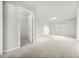 Spacious bedroom with neutral carpet, light gray walls, and ample natural light from a large window at 23 Chelsea Ct, Avondale Estates, GA 30002