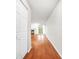 Hardwood floor entry hall with closet and view to living room at 23 Chelsea Ct, Avondale Estates, GA 30002