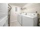 Well-equipped laundry room with modern washer and dryer units, offering convenience at 23 Chelsea Ct, Avondale Estates, GA 30002