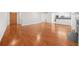 Hardwood floor living room with fireplace and kitchen views at 23 Chelsea Ct, Avondale Estates, GA 30002