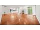 Hardwood floor living room with fireplace and kitchen views at 23 Chelsea Ct, Avondale Estates, GA 30002