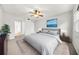 Comfortable primary bedroom with a ceiling fan, view, and ensuite bathroom access at 23 Chelsea Ct, Avondale Estates, GA 30002