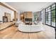 Bright living room featuring hardwood floors, modern seating, and large windows at 3770 Peachtree Ne Rd, Atlanta, GA 30319