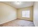 Cozy carpeted bedroom with a large window providing ample natural light at 1250 Parkwood Se Cir # 1004, Atlanta, GA 30339