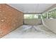 View of the carport with brick wall and ceiling at 1250 Parkwood Se Cir # 1004, Atlanta, GA 30339