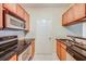 Functional kitchen equipped with modern appliances and dark countertops at 1250 Parkwood Se Cir # 1004, Atlanta, GA 30339