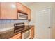 Close-up of the modern kitchen showcasing stainless steel oven and cooktop at 1250 Parkwood Se Cir # 1004, Atlanta, GA 30339