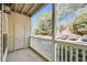 View from patio featuring white railings, trees, and a parking lot at 1250 Parkwood Se Cir # 1004, Atlanta, GA 30339