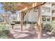 A park bench swing sits under a pergola at 1250 Parkwood Se Cir # 1004, Atlanta, GA 30339