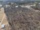 Aerial view of large lot with wooded area and road at 200 Heath Rd, Carrollton, GA 30116