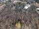 Aerial view of wooded lot with a pond at 200 Heath Rd, Carrollton, GA 30116