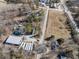 Aerial view of property showing large building, road, and surrounding land at 200 Heath Rd, Carrollton, GA 30116
