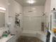 Spa-like bathroom with white subway tile, soaking tub, and shower at 200 Heath Rd, Carrollton, GA 30116