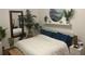Serene bedroom with a plush bed, large mirror, and plenty of plants at 200 Heath Rd, Carrollton, GA 30116
