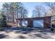 Two-car garage with ample space and concrete parking area at 200 Heath Rd, Carrollton, GA 30116