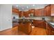 Kitchen boasts granite island, stainless steel appliances, and wood cabinets at 2858 Overlook Trce, Atlanta, GA 30324