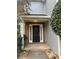 Inviting front entrance featuring a black door with sidelights and a well-maintained exterior at 8051 Woodlake Dr, Riverdale, GA 30274