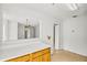 Eat-in kitchen area with white countertops, oak cabinets, view to living area, and tile floors at 1204 Riverview Se Dr, Marietta, GA 30067