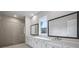 Bright bathroom with double vanity, sleek countertops, and a modern glass-enclosed shower at 6540 Namon Creek Trl, Cumming, GA 30028