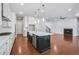 Spacious kitchen featuring a large island, stainless steel appliances, and an open layout at 6540 Namon Creek Trl, Cumming, GA 30028