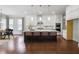 Modern kitchen with white cabinets, stainless steel appliances, and large island with seating at 6540 Namon Creek Trl, Cumming, GA 30028