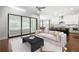 Open-concept living room and kitchen featuring a sliding glass door to the outside at 6540 Namon Creek Trl, Cumming, GA 30028