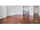 Open-concept living room featuring gleaming hardwood floors and an abundance of natural light at 6540 Namon Creek Trl, Cumming, GA 30028