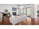 Cozy living room with fireplace, large sliding doors to the outside, and hardwood floors at 6540 Namon Creek Trl, Cumming, GA 30028