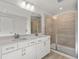 Bathroom boasts double vanity, quartz countertop, and a large shower at 714 Smokey Quartz Way, Kennesaw, GA 30144