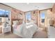Bright bedroom featuring butterfly-themed decor, large windows, and a comfortable bed at 714 Smokey Quartz Way, Kennesaw, GA 30144