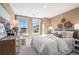 Bright bedroom with large windows, a comfortable bed, and stylish decor at 714 Smokey Quartz Way, Kennesaw, GA 30144