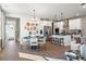Elegant dining room with stylish lighting and a view of the modern kitchen at 714 Smokey Quartz Way, Kennesaw, GA 30144