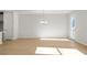 Bright dining room with hardwood floors and chandelier at 714 Smokey Quartz Way, Kennesaw, GA 30144