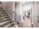 Elegant foyer and staircase leading into a bright living space, perfect for welcoming guests at 714 Smokey Quartz Way, Kennesaw, GA 30144