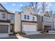 Two-story home with gray siding, stone accents, and a two-car garage at 714 Smokey Quartz Way, Kennesaw, GA 30144