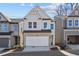 Two-story home with gray siding, stone accents, and a two-car garage at 714 Smokey Quartz Way, Kennesaw, GA 30144