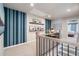 Open hallway featuring staircase, an accent wall, and a desk at 714 Smokey Quartz Way, Kennesaw, GA 30144