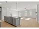 Open-concept kitchen with gray cabinetry and an island at 714 Smokey Quartz Way, Kennesaw, GA 30144