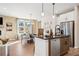 Bright kitchen with stainless steel appliances, kitchen island, and breakfast area and hardwood floors at 714 Smokey Quartz Way, Kennesaw, GA 30144